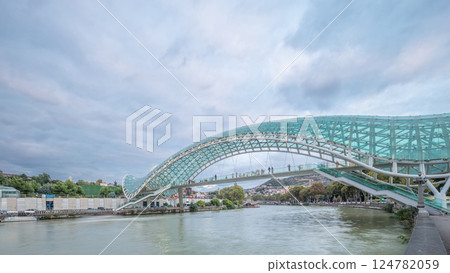 Timelapse panorama of the Bridge of Peace, a bow-shaped pedestrian bridge in Tbilisi, Georgia 124782059