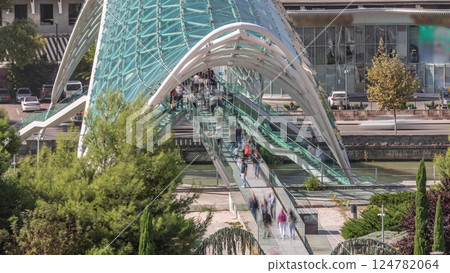 Timelapse of the Bridge of Peace, a bow-shaped pedestrian bridge in Tbilisi, Georgia Timelapse of the Bridge of Peace, a bow-shaped pedestrian bridge in Tbilisi, Georgia 124782064