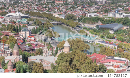 Aerial timelapse of the Bridge of Peace, a bow-shaped pedestrian bridge in Tbilisi, Georgia 124782117