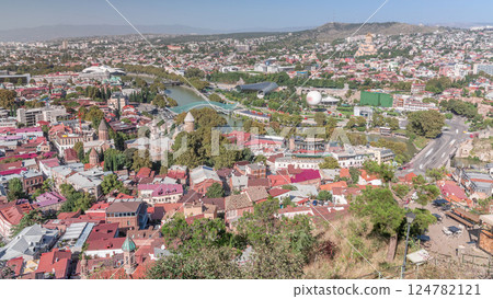 Colorful traditional houses with wooden balconies and red roofs in the Old Town of Tbilisi aerial timelapse, Georgia. Colorful traditional houses with wooden balconies and red roofs in the Old Town of Tbilisi aerial timelapse, Georgia. 124782121