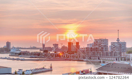 Aerial timelapse panorama of Katendrecht peninsula and Maashaven harbour at sunset in Rotterdam, The Netherlands. 124782264