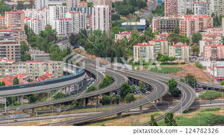 Aerial top view of highway multilevel junction road in urban populated area timelapse. Aerial top view of highway multilevel junction road in urban populated area timelapse. 124782326