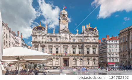 Hyperlapse of Hotel de Ville de Lyon, the historic city hall of Lyon, France. People stroll near the fountain on the square timelapse. 124782392