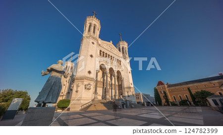 Hyperlapse front view of the Basilica of Notre Dame de Fourviere during sunset in Lyon, France. Hyperlapse front view of the Basilica of Notre Dame de Fourviere during sunset in Lyon, France. 124782399