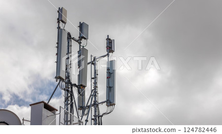 Telecommunication tower timelapse with white clouds and blue sky on a background. 3G, 4G and 5G Cell Site 124782446