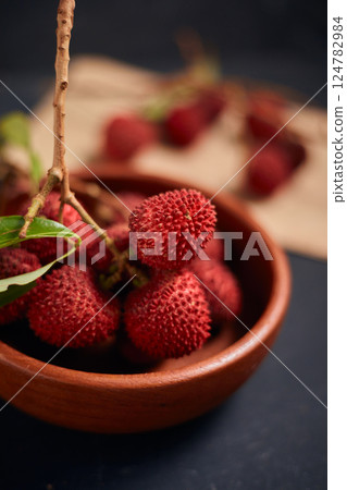 Fresh red lychee fruits with leaves 124782984