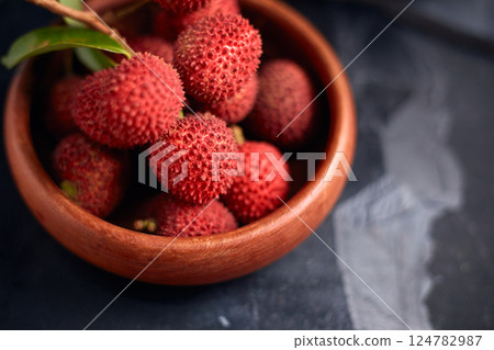 Fresh red lychee fruits with leaves 124782987