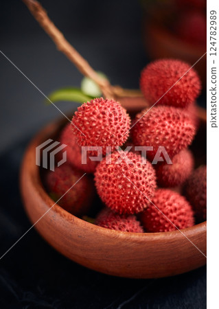 Fresh red lychee fruits with leaves 124782989
