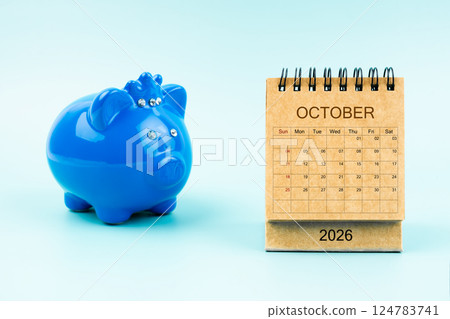 Blue piggy bank and blank October 2026 calendar, Reminder schedule of savings money. 124783741