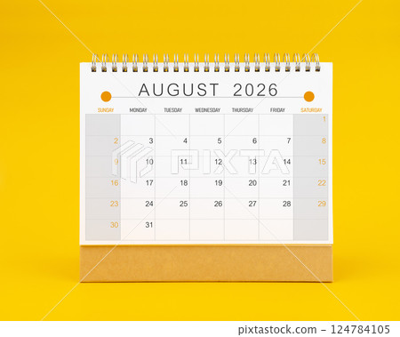 August 2026 desk calendar on yellow background, Front view. 124784105