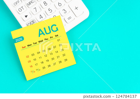 August 2026 calendar page with calculator on blue background. August 2026 calendar page with calculator on blue background. 124784137