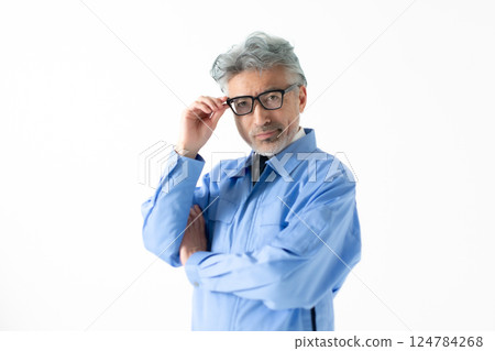 A man wearing work clothes A man wearing work clothes 124784268