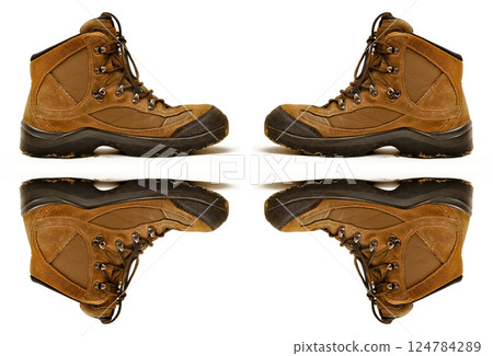 Hiking shoes and a white background, sturdy hiking boots, strong hiking beige and brown boots 124784289
