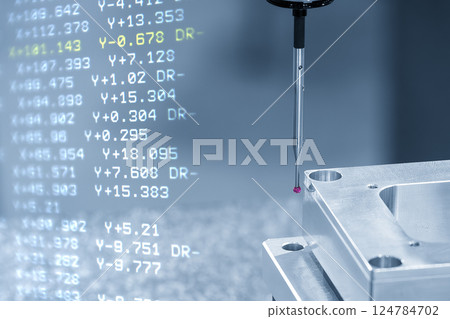 Abstract scene the CMM machine measuring the aluminum parts and G-code data background. Abstract scene the CMM machine measuring the aluminum parts and G-code data background. 124784702