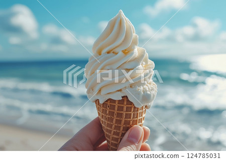 Person holds ice cream in waffle cone with melting edges 124785031