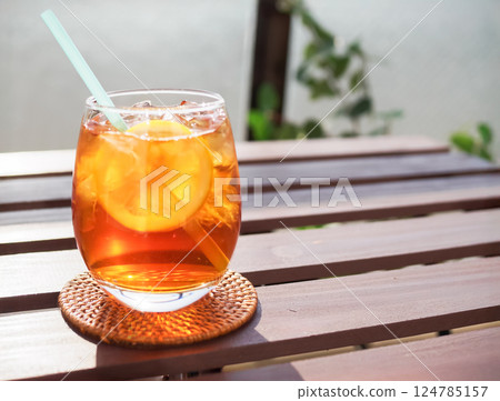 Iced lemon tea on an outdoor table 124785157