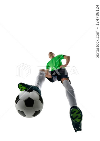 Low angle of skilled man, dressed sport uniform, soccer player preparing long pass in motion against white studio background. 124786124