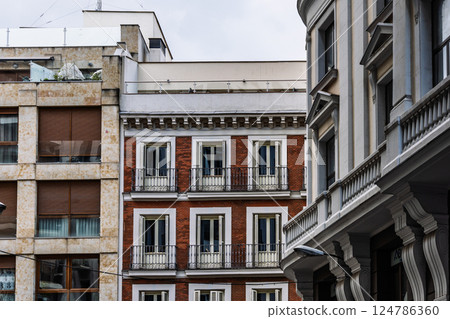 A close-up view of Madrid architectural elegance along the bustling Gran Via street. 124786360