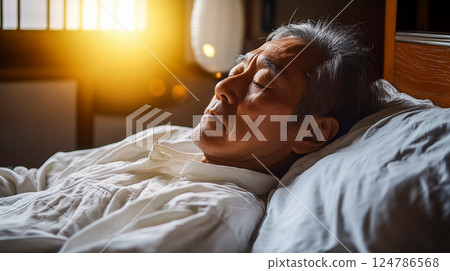 Senior man sleeping in the morning sun Senior man sleeping in the morning sun 124786568