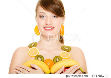 Diet. Girl with necklace of fresh citrus fruits isolated Diet. Girl with necklace of fresh citrus fruits isolated 124786700