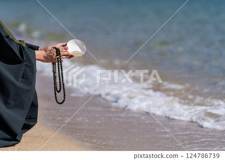 An image of ocean scattering where monks hold a memorial service in the sea An image of ocean scattering where monks hold a memorial service in the sea 124786739