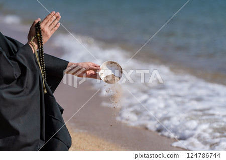 An image of ocean scattering where monks hold a memorial service in the sea An image of ocean scattering where monks hold a memorial service in the sea 124786744