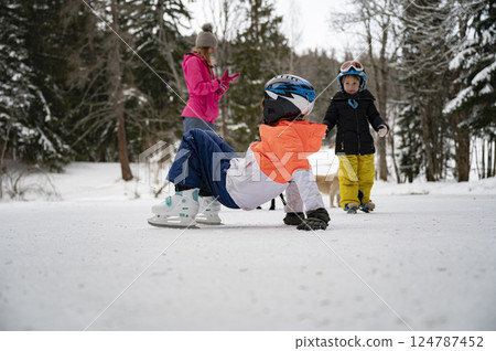 Kids enjoying winter Ice fun 124787452