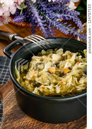 Stewed cabbage with onion and greaves. 124787533