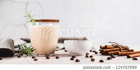 Aromatic coffee with rosemary and cinnamon in a glass on the table web banner Aromatic coffee with rosemary and cinnamon in a glass on the table web banner 124787699