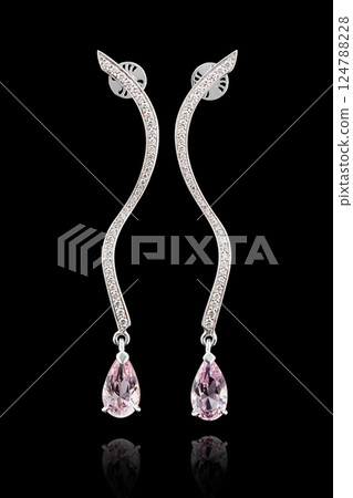 earrings silver, gold with stone morganite, diamonds on black background 124788228