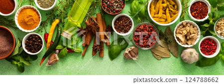 A beautiful collection of colorful spices and herbs, showcasing their natural aromas and vibrant hues on a gentle green background, top view , banner A beautiful collection of colorful spices and herbs, showcasing their natural aromas and vibrant hues on a gentle green background, top view , banner 124788662