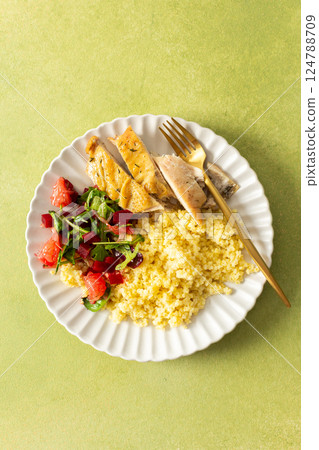 A healthy breakfast plate with millet, lean chicken breast, a citrusy salad with grapefruit, combining protein, fiber and vitamins for a nourishing start A healthy breakfast plate with millet, lean chicken breast, a citrusy salad with grapefruit, combining protein, fiber and vitamins for a nourishing start 124788709