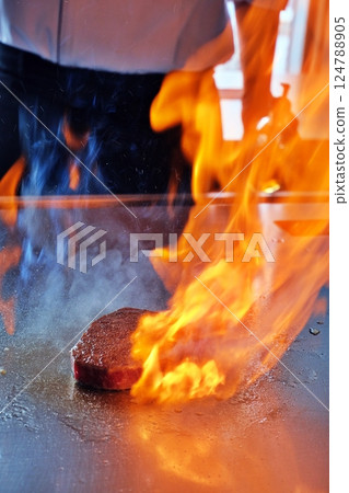 Steak flambé scene Steak flambé scene 124788905