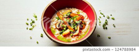 A warm bowl of oatmeal with chicken broth, fried mushrooms, and green onions, featuring a minimalist arrangement and vibrant, natural colors, banner A warm bowl of oatmeal with chicken broth, fried mushrooms, and green onions, featuring a minimalist arrangement and vibrant, natural colors, banner 124788984