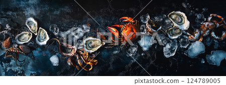 A premium seafood platter with oysters, crab, and squid on a deep blue background, enhanced by ice chunks and soft lighting, creating a refined and appetizing gourmet scene, banner 124789005