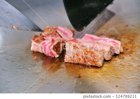 Steak cooking scene 124789211