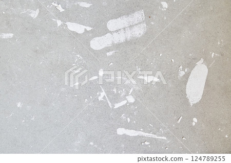 A concrete wall with putty stains. Uneven wall surface with space for copying. High quality photo 124789255
