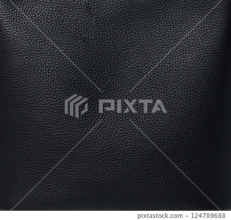 Close-up of black textured leather surface showing detailed grain pattern Close-up of black textured leather surface showing detailed grain pattern 124789688