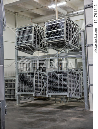 Equipment for turning over bottles of sparkling wine at winery. 124791241