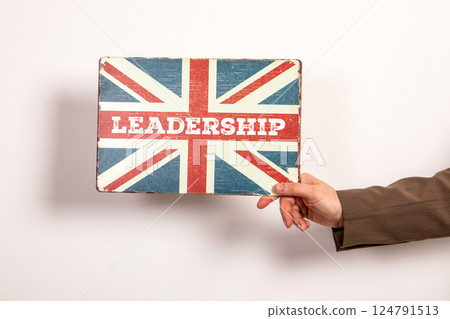 Leadership Concept with Vintage Union Jack Sign Held by Hand 124791513