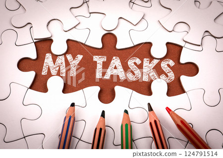 MY TASKS. White puzzle pieces and colored pencils MY TASKS. White puzzle pieces and colored pencils 124791514