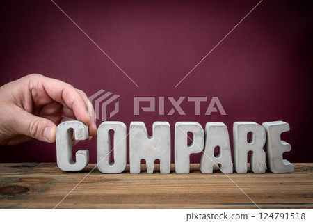 COMPARE Word Created from Concrete Alphabet Letters on Wooden Desk COMPARE Word Created from Concrete Alphabet Letters on Wooden Desk 124791518
