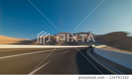 Curvy road through the Jebel Hafeet road timelapse hyperlapse, Al Ain, United Arab Emirates Curvy road through the Jebel Hafeet road timelapse hyperlapse, Al Ain, United Arab Emirates 124791582