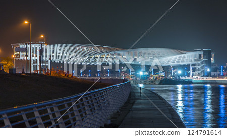 New pedestrian bridge over the Dubai Water Canal illuminated at night timelapse. United Arab Emirates, Middle East New pedestrian bridge over the Dubai Water Canal illuminated at night timelapse. United Arab Emirates, Middle East 124791614