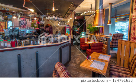 Modern cafe interior with counter and wooden tables with chairs timelapse Modern cafe interior with counter and wooden tables with chairs timelapse 124791633