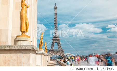 Eiffel Tower and the golden statues of women in the sun light timelapse, Trocadero square, Paris, France 124791659