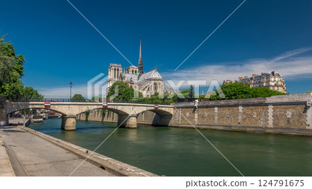 Seine and Notre Dame de Paris timelapse hyperlapse is the one of the most famous symbols of Paris 124791675