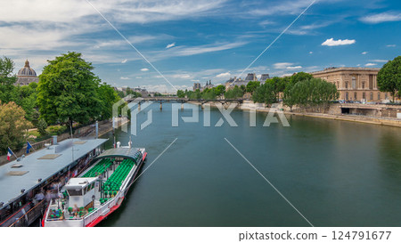 Touristic boat passes below Pont des Arts and stop on boat station on Seine river timelapse hyperlapse in Paris. Touristic boat passes below Pont des Arts and stop on boat station on Seine river timelapse hyperlapse in Paris. 124791677