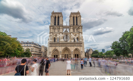 Front view of Notre-Dame de Paris timelapse hyperlapse, a medieval Catholic cathedral on the Cite Island in Paris, France Front view of Notre-Dame de Paris timelapse hyperlapse, a medieval Catholic cathedral on the Cite Island in Paris, France 124791680