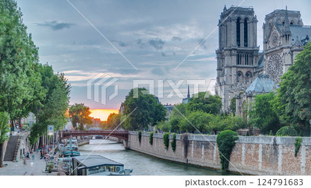 Sunset view of Cathedral Notre Dame de Paris timelapse in Paris, France. Sunset view of Cathedral Notre Dame de Paris timelapse in Paris, France. 124791683